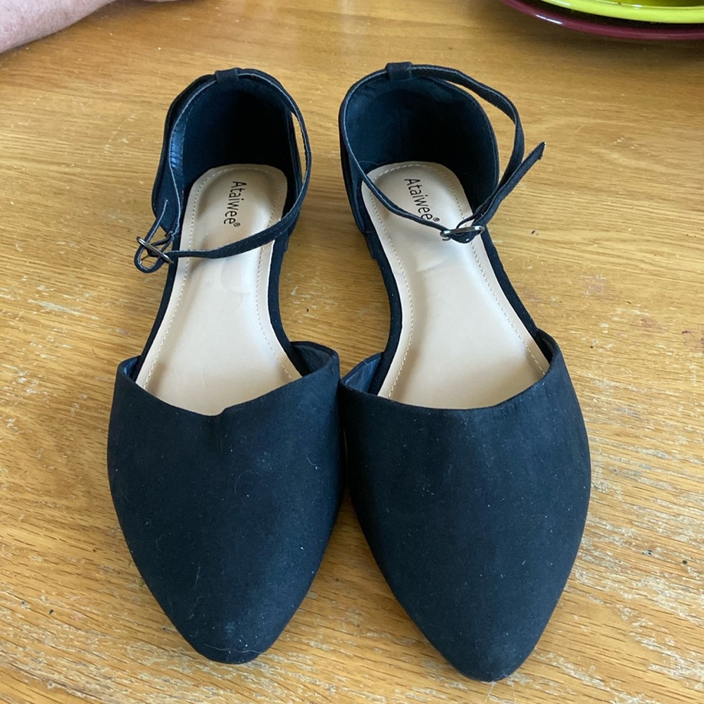 Black suede flats with ankle strap.